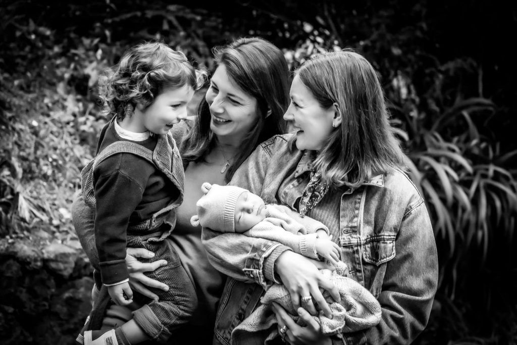 black and white portrait of two moms with newborn and young child by Berkeley area photographer Shelly Rivoli