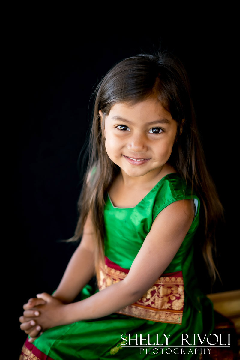 children's portrait of a young girl in a green dress by photographer Shelly Rivoli