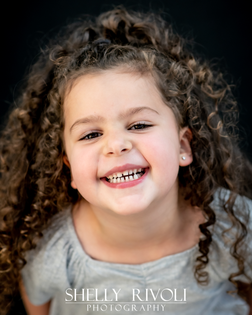 children's portrait of cute girl grinning by Bay Area childrens photographer Shelly Rivoli