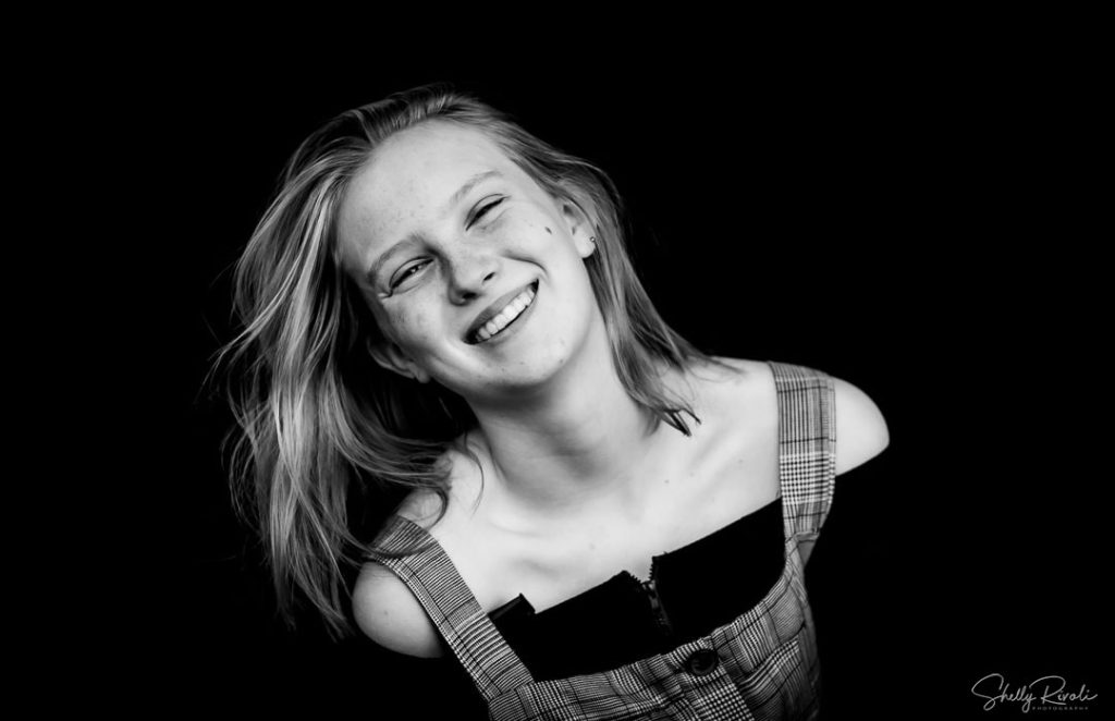 BW children's portrait of teen girl laughing by Bay Area childrens photographer Shelly Rivoli
